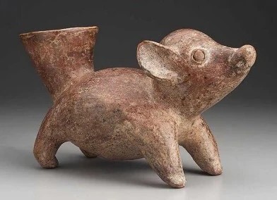 Pre-Hispanic ceramic figure resembling a small dog, associated with the ancestors of the Chihuahua.