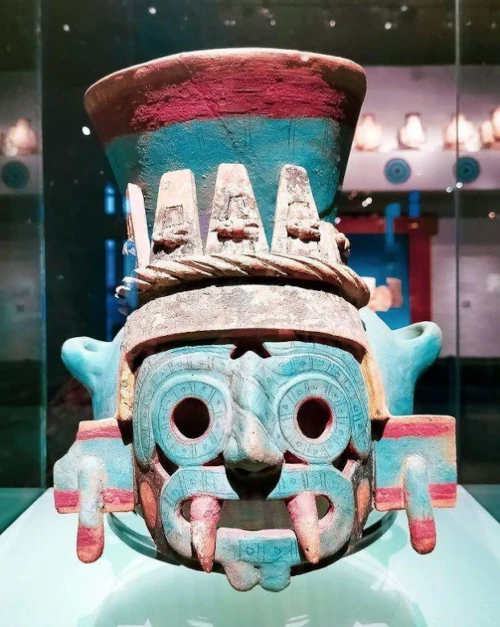 Mexica representation of Tlaloc associated with the Templo Mayor, featuring blue-green coloration symbolizing water and connecting the aquatic symbolism of ancient Mexico to Atlalli.